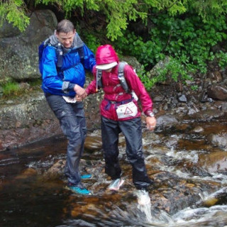 Crossing a river in the Bèrghem Ultra 135K