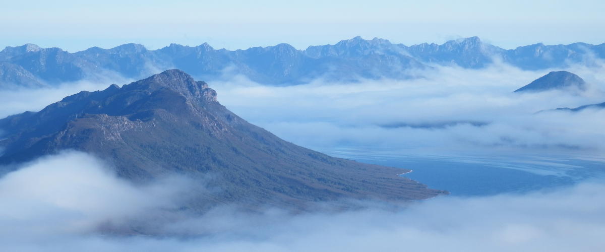 The fog lifts revealing Scott's Peak, Tasmania